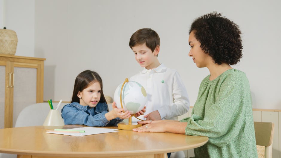 Children with a teacher learning geography through a globe at home